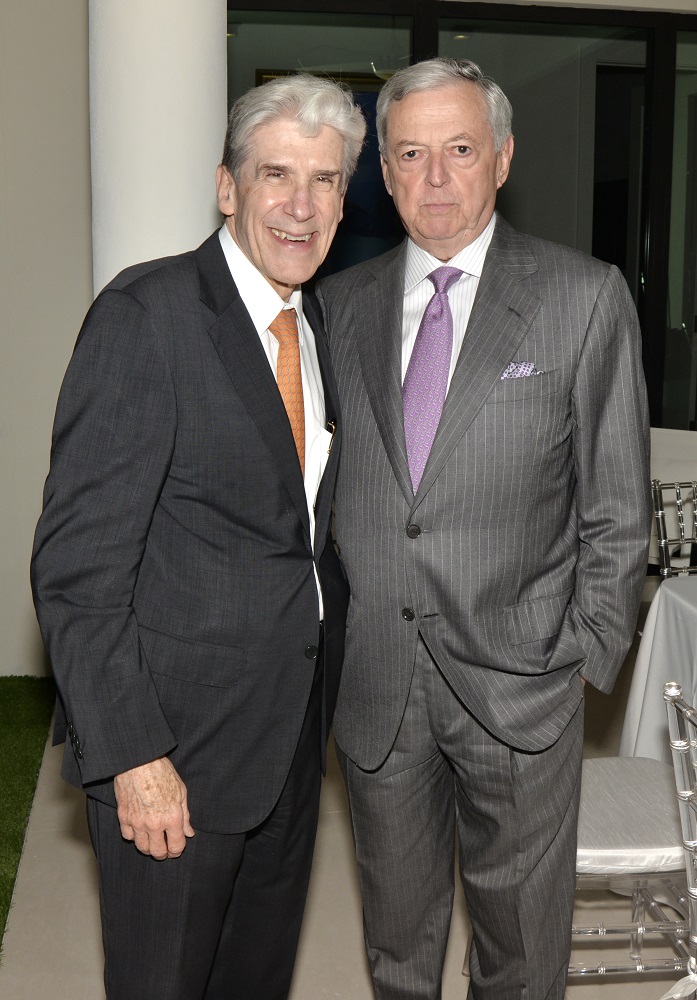 President of University of Miami Julio Frenk and Armando Codina at the US Century Bank dinner in honor of the Council General of Spain, Ambassador Jaime Lacadena, Marquee of La Cadena at the home of Aida Levitan