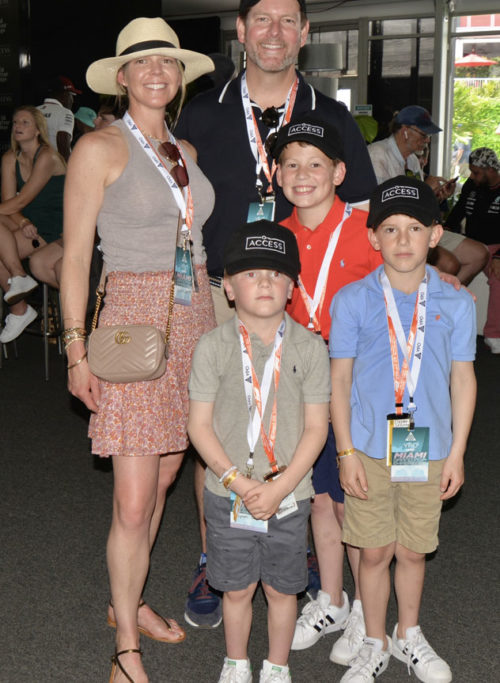 Kristin and Matthew Whitman Lazenby and kids at the Bal Harbour Shops ACCESS suite at F1 Miami Grand Prix at the Hard Rock Stadium