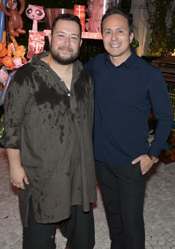 Artist Jose Campos aka Studio Lenca, and Mario Cader-Frech at the home of Mario Cader-Frech and Robert Wennett for a cocktail party premiering Chisme by Studio Lenca and honoring The Parrish Art Museum