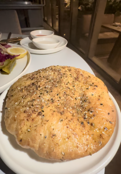 Warm pita bread with herbs (photo by SocialMiami)