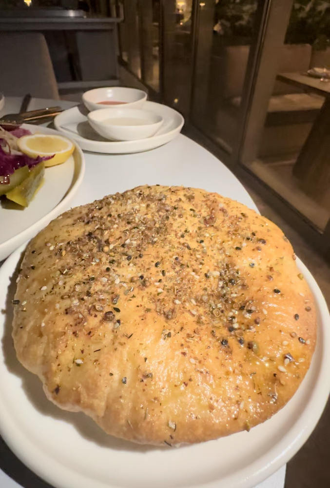 Warm pita bread with herbs (photo by SocialMiami)