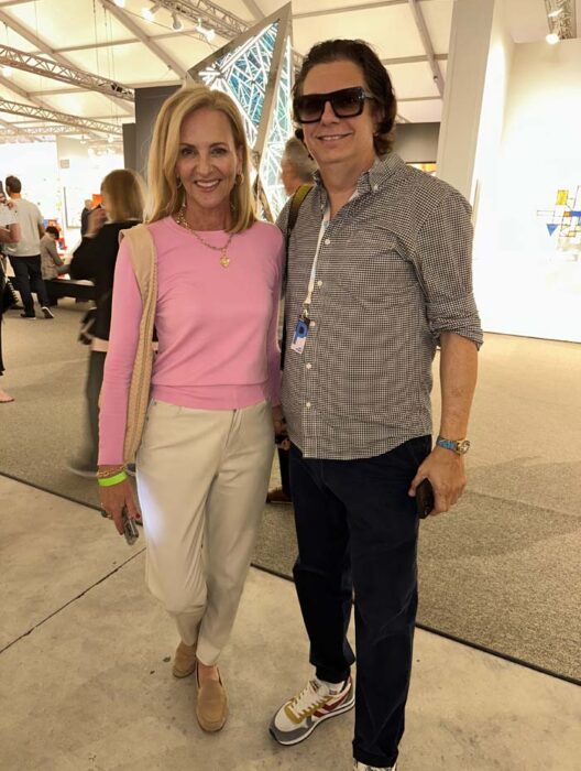 Reporter Lisa Petrillo and celebrity photographer Manny Hernandez at CONTEXT Art Miami