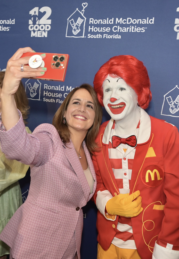 Soraya Rivera-Moya and Ronald McDonald at the Ronald McDonald House of South Florida 12 Good Men luncheon at the Loews Coral Gables