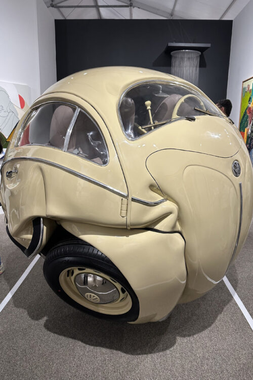 Volkswagen sphere sculpture made from original parts of a 1953 Beetle, showcased by Art of the World Gallery from Houston priced at $160,000