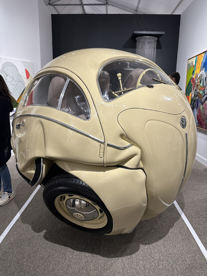 Volkswagen sphere sculpture made from original parts of a 1953 Beetle, showcased by Art of the World Gallery from Houston priced at $160,000